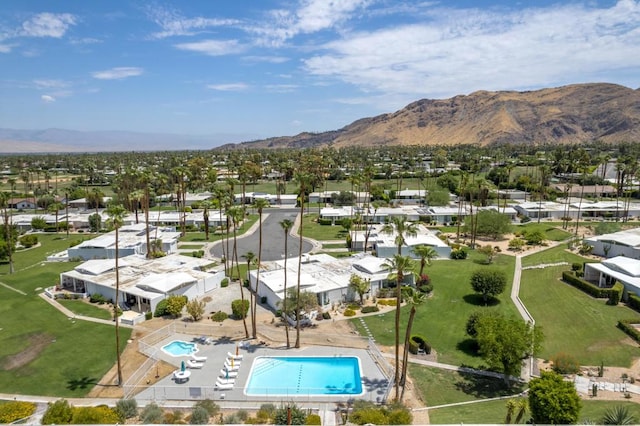 birds eye view of property with a mountain view