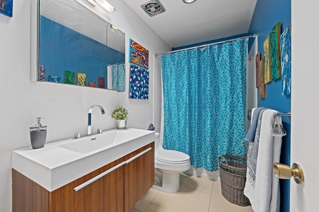 bathroom with vanity, toilet, tile patterned floors, and a shower with shower curtain