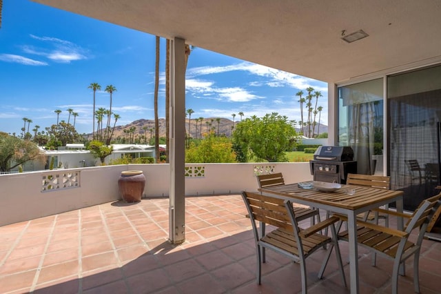 view of patio featuring a mountain view and area for grilling