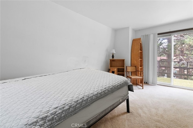 carpeted bedroom featuring access to outside