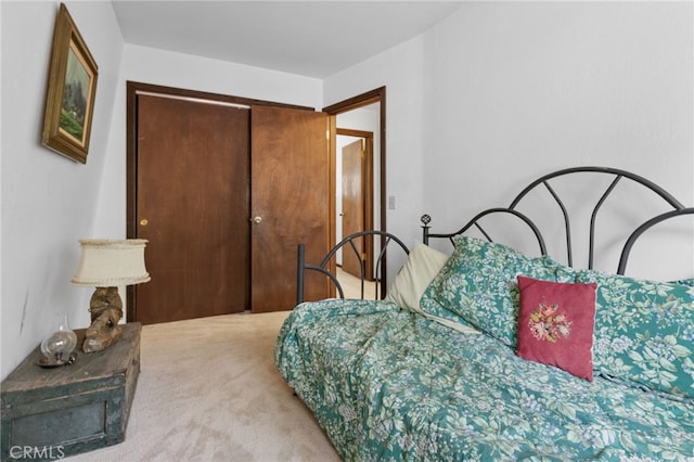 carpeted bedroom with a closet