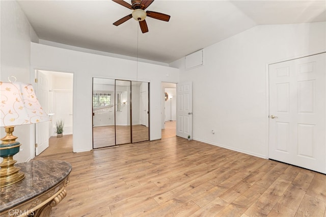 bedroom featuring a ceiling fan, light wood-type flooring, lofted ceiling, and baseboards