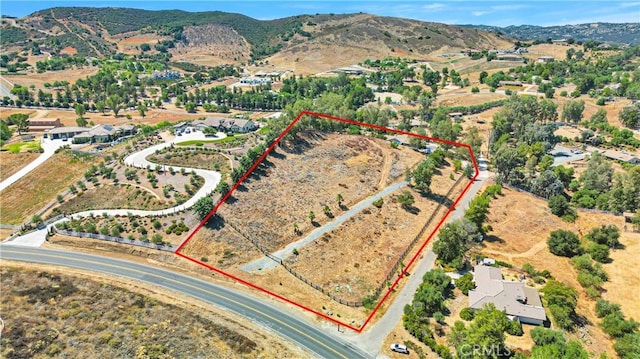 drone / aerial view featuring a mountain view