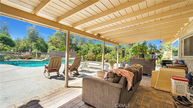 view of patio / terrace with a fenced in pool and an outdoor hangout area