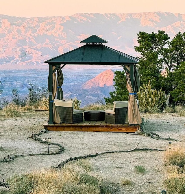 view of play area with a gazebo and a deck with mountain view