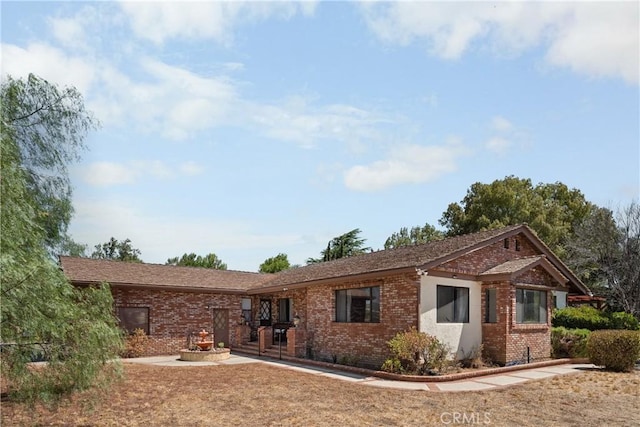 view of front of home with a patio area