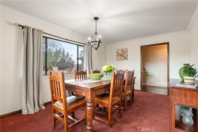 dining space featuring dark colored carpet, crown molding, and a notable chandelier