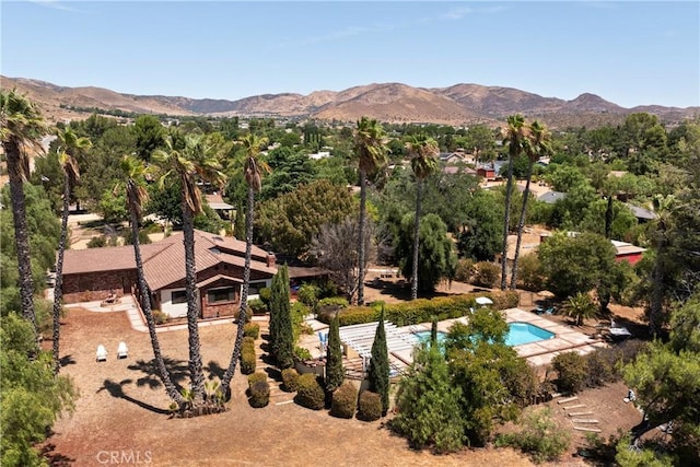 birds eye view of property with a mountain view