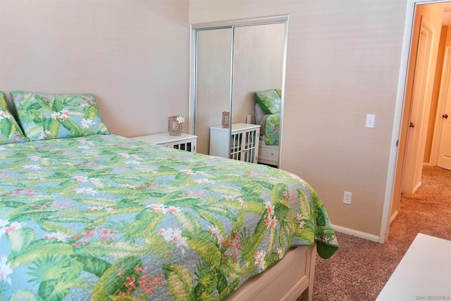 bedroom featuring light carpet and a closet