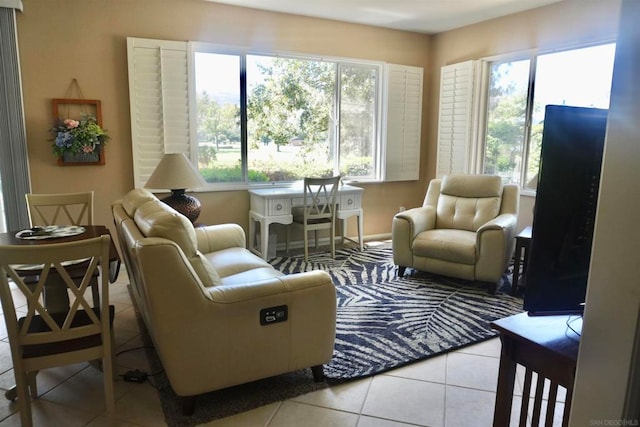 living room with light tile patterned floors and plenty of natural light