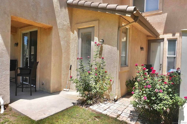 property entrance with a patio