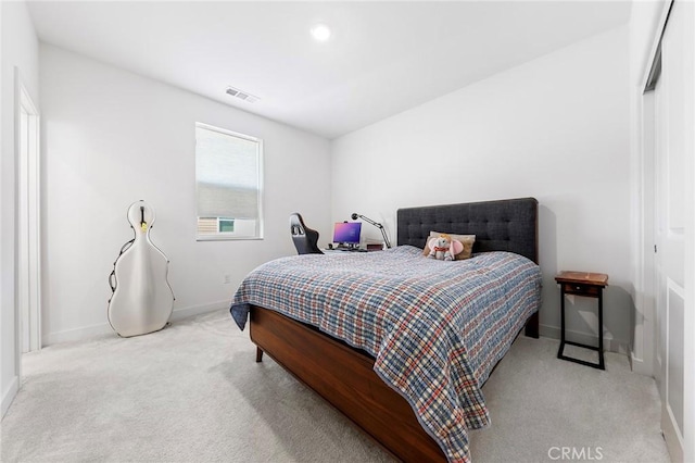 bedroom featuring light carpet