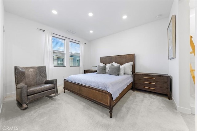 bedroom with light colored carpet