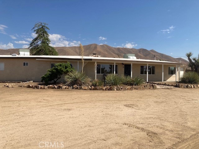 rear view of house with a mountain view