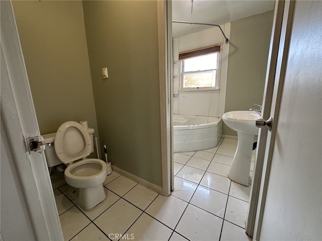 bathroom with tile patterned floors, toilet, and sink