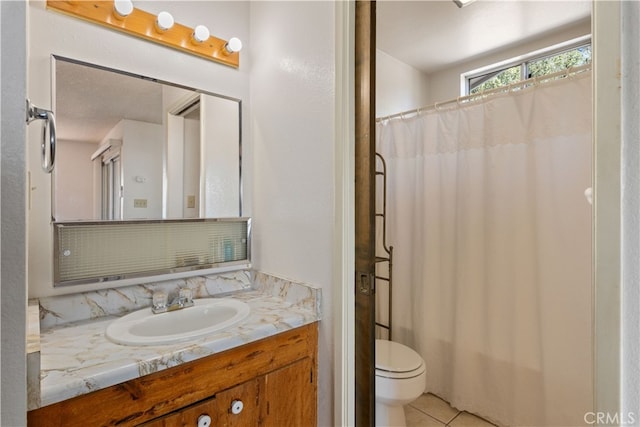 bathroom with vanity, a textured ceiling, tile patterned flooring, a shower with shower curtain, and toilet