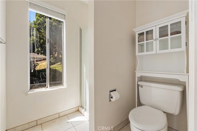 bathroom with tile patterned floors and toilet