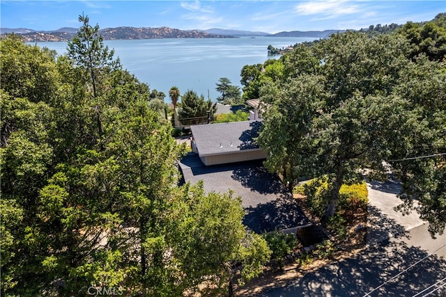 drone / aerial view featuring a water and mountain view