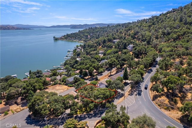 bird's eye view with a water and mountain view