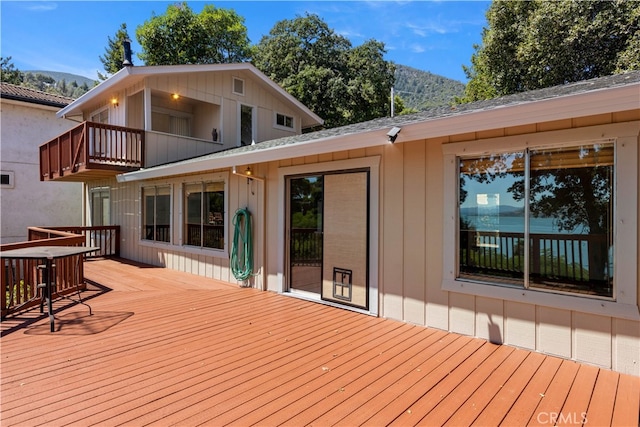 wooden deck with a mountain view