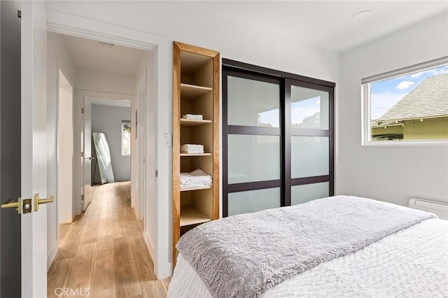 bedroom featuring light hardwood / wood-style flooring