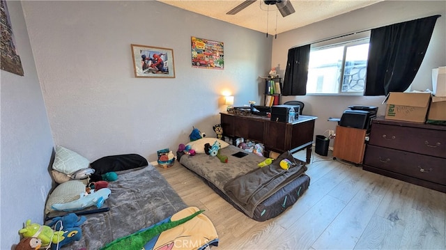 bedroom with wood finished floors and ceiling fan