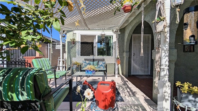 view of patio with fence and a deck