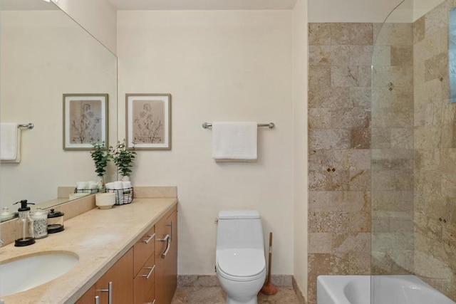 full bathroom featuring toilet, tiled shower / bath combo, and vanity