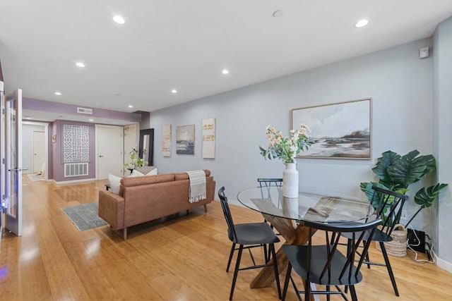 dining space featuring light hardwood / wood-style floors