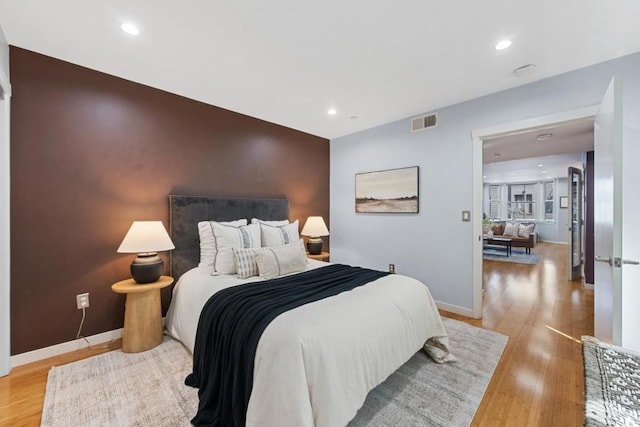 bedroom with light hardwood / wood-style flooring