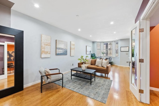 living room with light hardwood / wood-style flooring