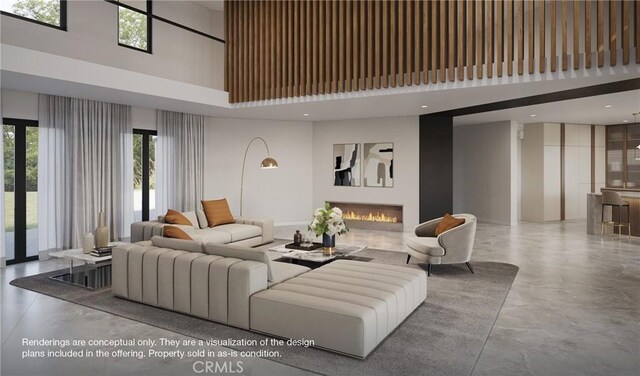 1 Gallery Pl, Newport Coast, CA 92657 - interior space featuring a glass covered fireplace, a wealth of natural light, a towering ceiling, and finished concrete floors