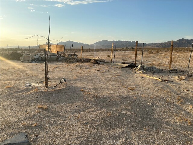 view of yard featuring a mountain view and a rural view