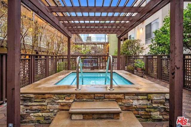 view of swimming pool featuring a pergola and a community hot tub