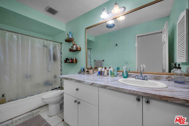 full bathroom with tile patterned flooring, shower / bath combo, vanity, and toilet