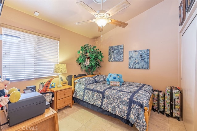 bedroom with ceiling fan, a closet, and vaulted ceiling