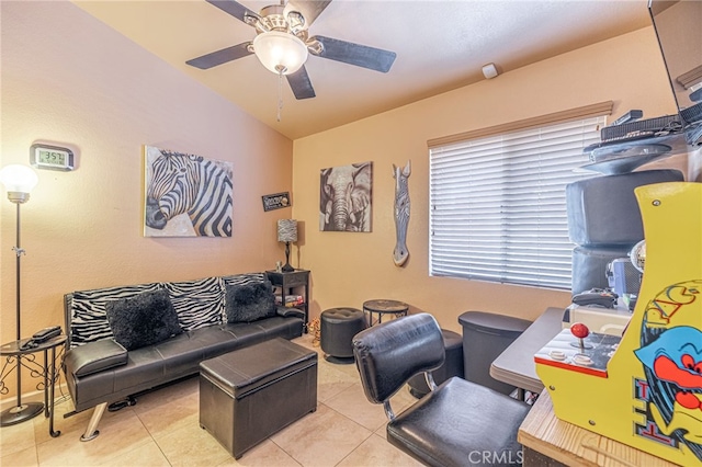 tiled living room featuring ceiling fan and lofted ceiling