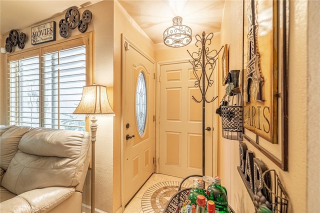 tiled foyer entrance featuring a healthy amount of sunlight