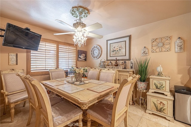 tiled dining area featuring a textured ceiling