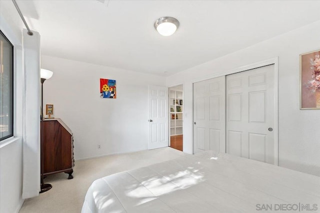 carpeted bedroom featuring a closet