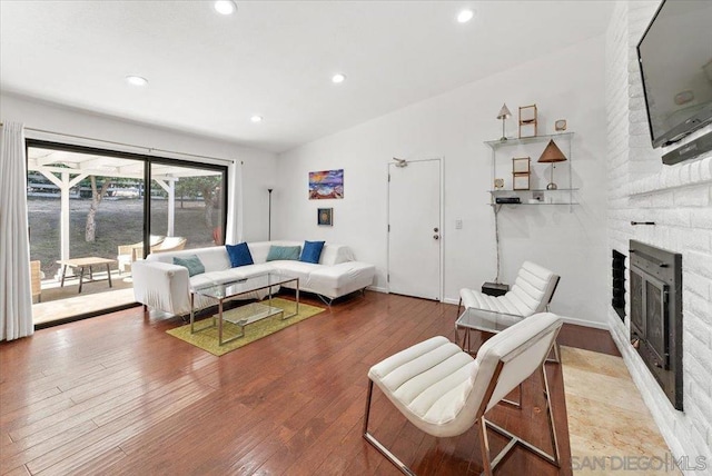 living room featuring a fireplace and light hardwood / wood-style floors