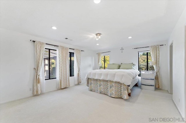 bedroom with light colored carpet