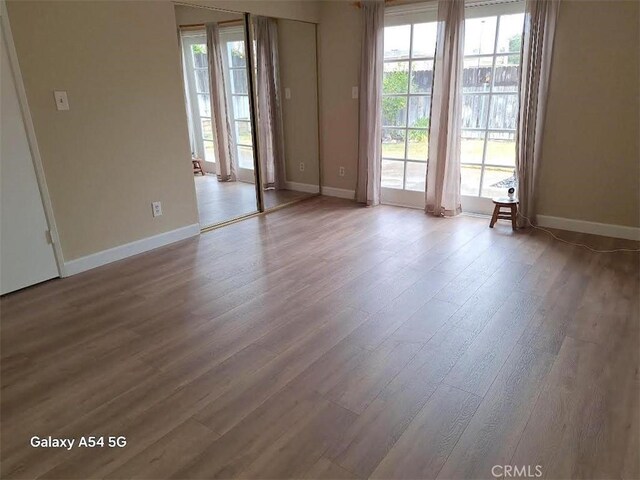 spare room with light hardwood / wood-style flooring