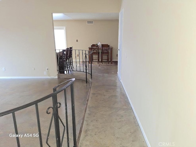 corridor with concrete flooring