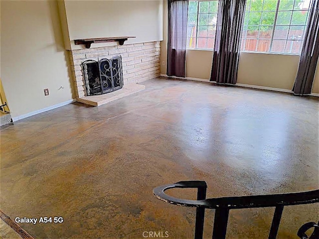 unfurnished living room with a fireplace