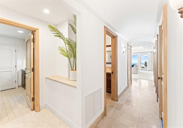 hall with light tile patterned flooring