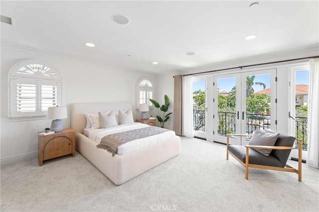 carpeted bedroom with access to exterior, crown molding, and french doors