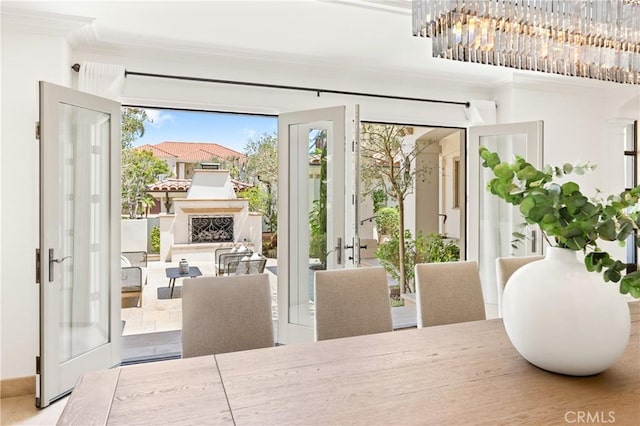 doorway to outside featuring ornamental molding and french doors