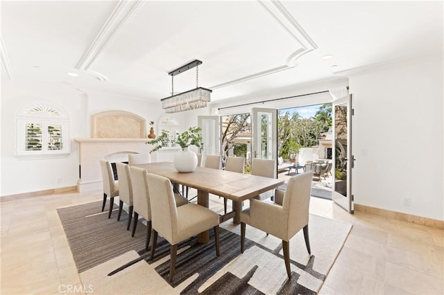 tiled dining space with plenty of natural light and a notable chandelier