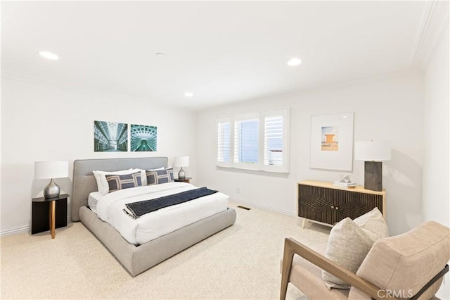 carpeted bedroom with ornamental molding